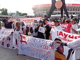 Madres buscadoras protestan frente al Estadio Banorte, el sábado.