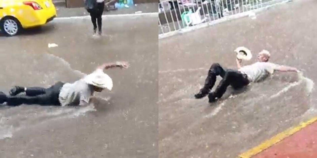 Hombre nada en corriente de agua que deja lluvia
