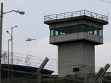 An Ecuadorian armed forces helicopter flies over the 'Zonal 8' prison while their ground forces carry out an identity check, amid the ongoing wave of violence around the nation, in Guayaquil, Ecuador, January 14, 2024. REUTERS/Ivan Alvarado