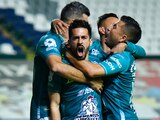 Jugadores de León celebra una anotación contra el Puebla en los Cuartos de Final del Guard1anes 2020