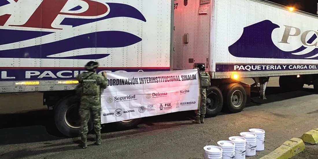 Elementos de la Semar custodian camiones y cargamento decomisados, ayer