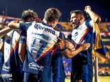 Jugadores del América festejan uno de sus goles contra Tigres.