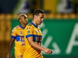 Jesús Dueñas y Diego Reyes después de un partido de Tigres en el Guard1anes 2021 de la Liga MX.