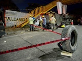 Members of Civil Protection remove a body at the site of a trailer accident that left at least 49 people dead, most of them migrants from Central America, in Tuxtla Gutierrez, in Chiapas state, Mexico December 9, 2021. REUTERS/Jacob Garcia