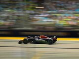 Red Bull driver Max Verstappen of the Netherlands speeds his car during the qualifying session at the Singapore Formula One Grand Prix, at the Marina Bay City Circuit in Singapore, Saturday, Oct. 1, 2022. (AP Photo/Vincent Thian)