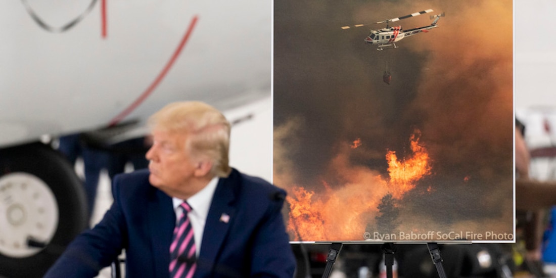 El presidente, frente a una fotografía del desastre forestal, ayer, en California.
