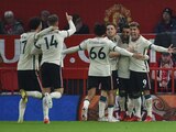 Jugadores del Liverpool celebran un gol ante el Manchester United