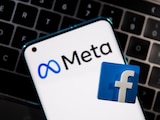A smartphone with Meta logo and a 3D printed Facebook logo is placed on a laptop keyboard in this illustration taken, October 28, 2021. REUTERS/Dado Ruvic/Illustration