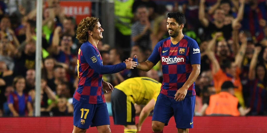 Griezmann y Suárez festejan un gol del conjunto blaugrana este año.