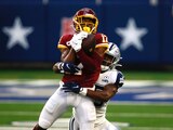 Una acción del duelo entre Cowboys y Washington de la NFL