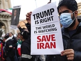 Un hombre iraní sostiene una pancarta en apoyo a Donald Trump, el 19 de enero.