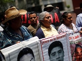 Padres y madres de los normalistas desaparecidos de Ayotzinapa.