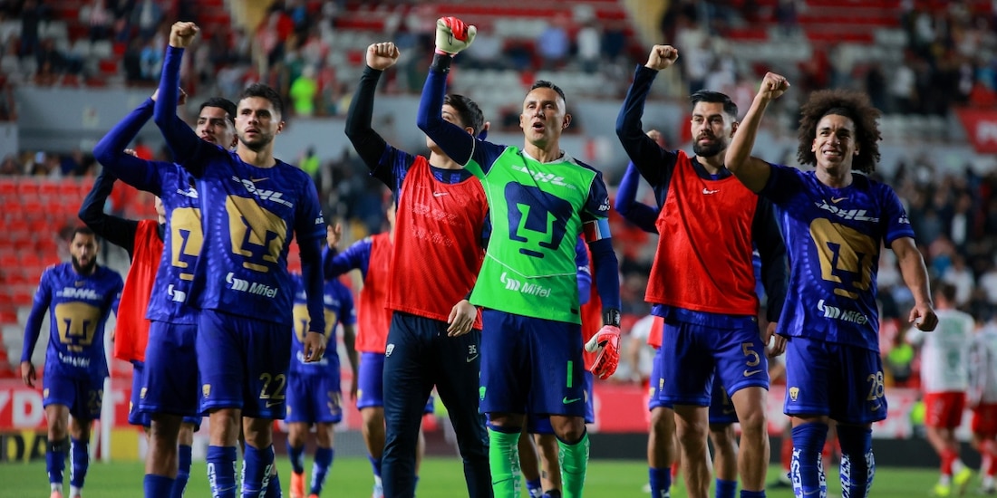 Jugadores de los Pumas en un partido de la Liga MX