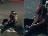 Perrito acompaña a su dueña en plena inundación bajo la lluvia y conmueve en redes sociales