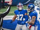 Jugadores de los Giants celebran una anotación ante los Cowboys en la Semana 17 de la NFL
