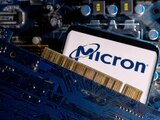 FILE PHOTO: A smartphone with a displayed Micron logo is placed on a computer motherboard in this illustration taken March 6, 2023. REUTERS/Dado Ruvic/Illustration/File Photo