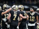 Los New Orleans Saints celebran un touchdown contra los Detroit Lions en la Semana 13 de la NFL.