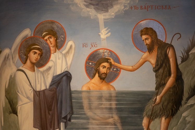 Representación de San Juan Bautista durante el bautizo de Jesús
