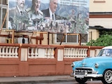 UN COCHE antiguo pasa por una publicidad política en La Habana, el 15 de mayo.